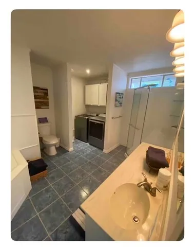 a bathroom with a bathtub and a sink