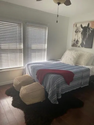 a bedroom with a bed and window