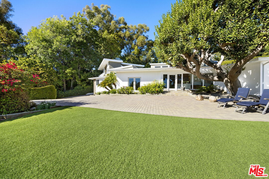 11215 Sunset Boulevard Los Angeles, CA 90049 - Photo 12 of 74 a view of a house with a yard