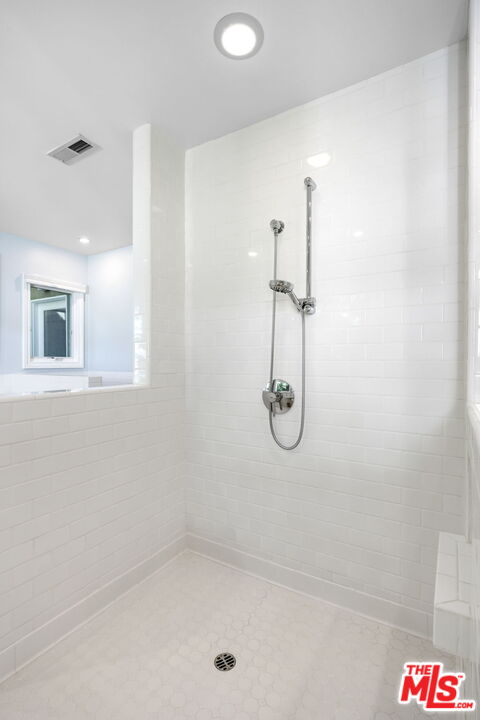 11215 Sunset Boulevard Los Angeles, CA 90049 - Photo 46 of 74 a bathroom with a shower