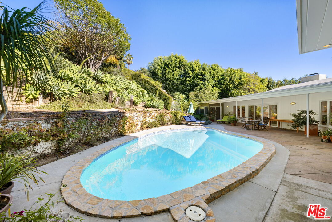 11215 Sunset Boulevard Los Angeles, CA 90049 - Photo 62 of 74 a view of a swimming pool with a patio