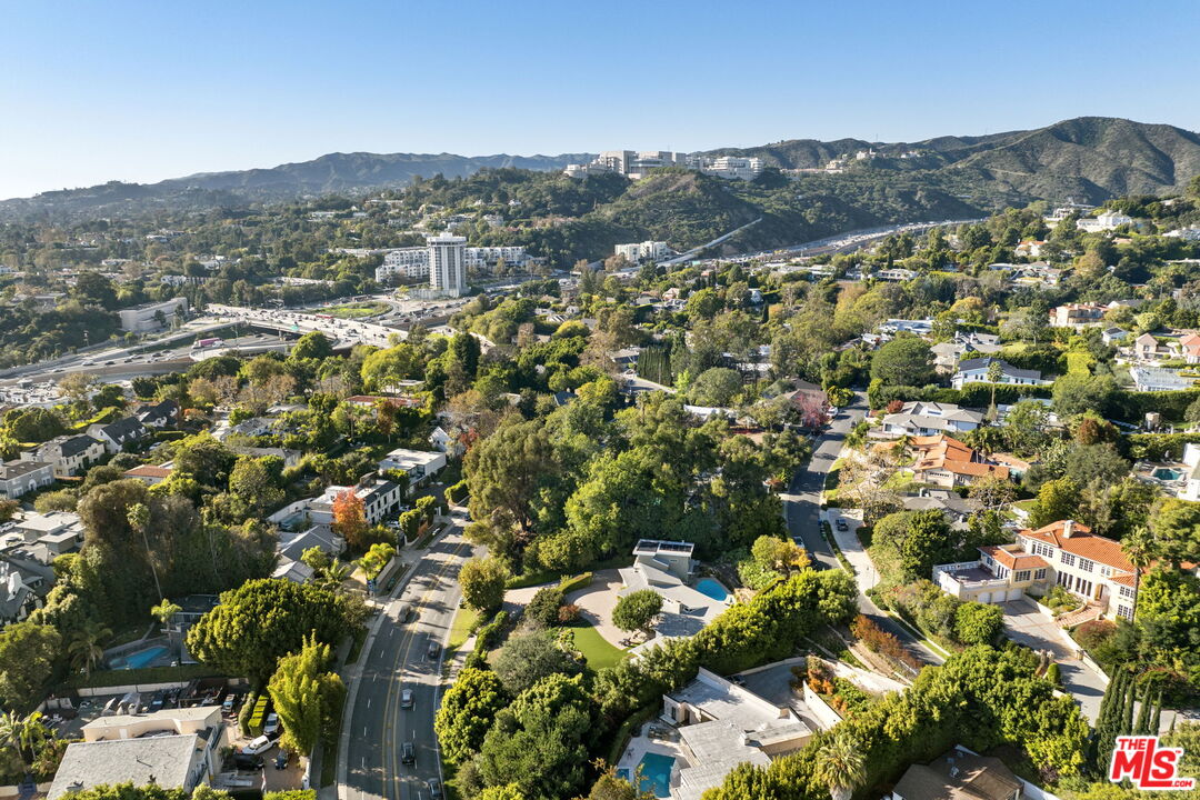 11215 Sunset Boulevard Los Angeles, CA 90049 - Photo 73 of 74 an aerial view of residential houses with outdoor space and trees
