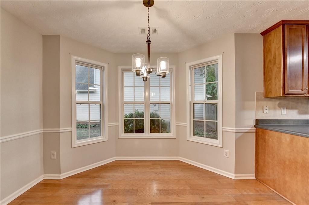 310 Andrew Ridge Drive Jefferson, GA 30549 - Photo 26 of 52 a view of an empty room with a window and wooden floor