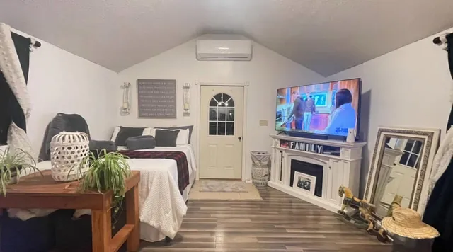 a living room with furniture and a fireplace