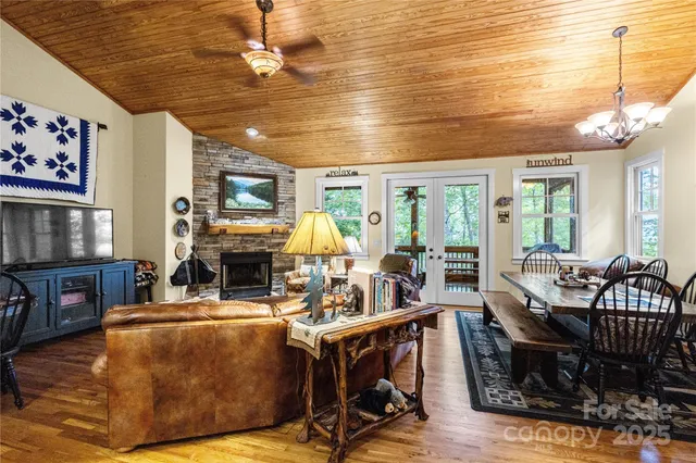a living room with fireplace furniture and a flat screen tv