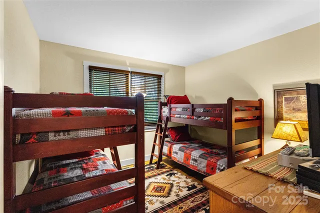 a bedroom with furniture and a window