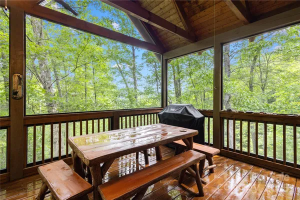 a view of a balcony with wooden floor
