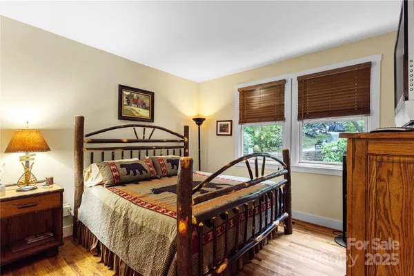 a bedroom with furniture and a window