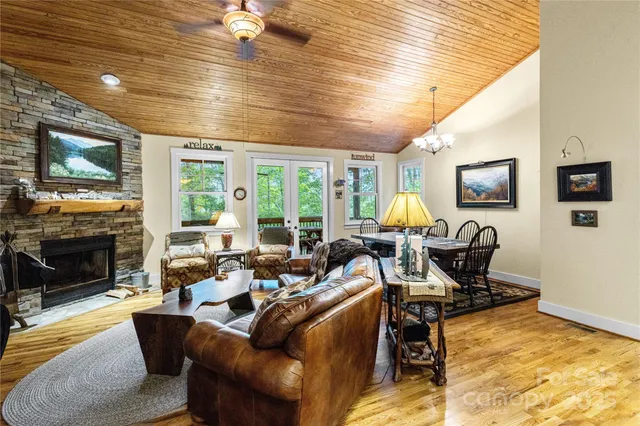 a living room with furniture fireplace and a flat screen tv
