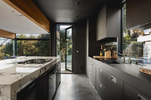 a view of a patio with a table and chairs