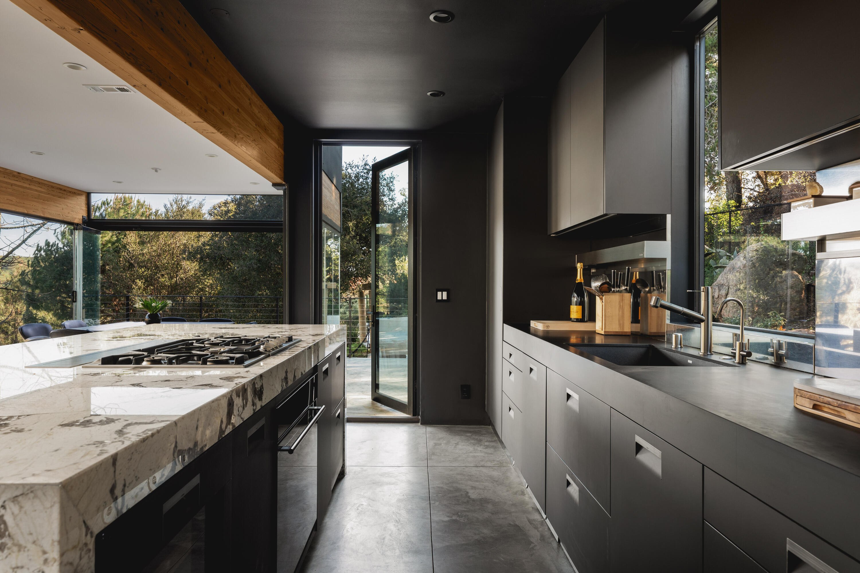 2315 Live Oak Meadows Road Malibu, CA 90265 - Photo 11 of 32 a kitchen with stainless steel appliances granite countertop sink stove and refrigerator