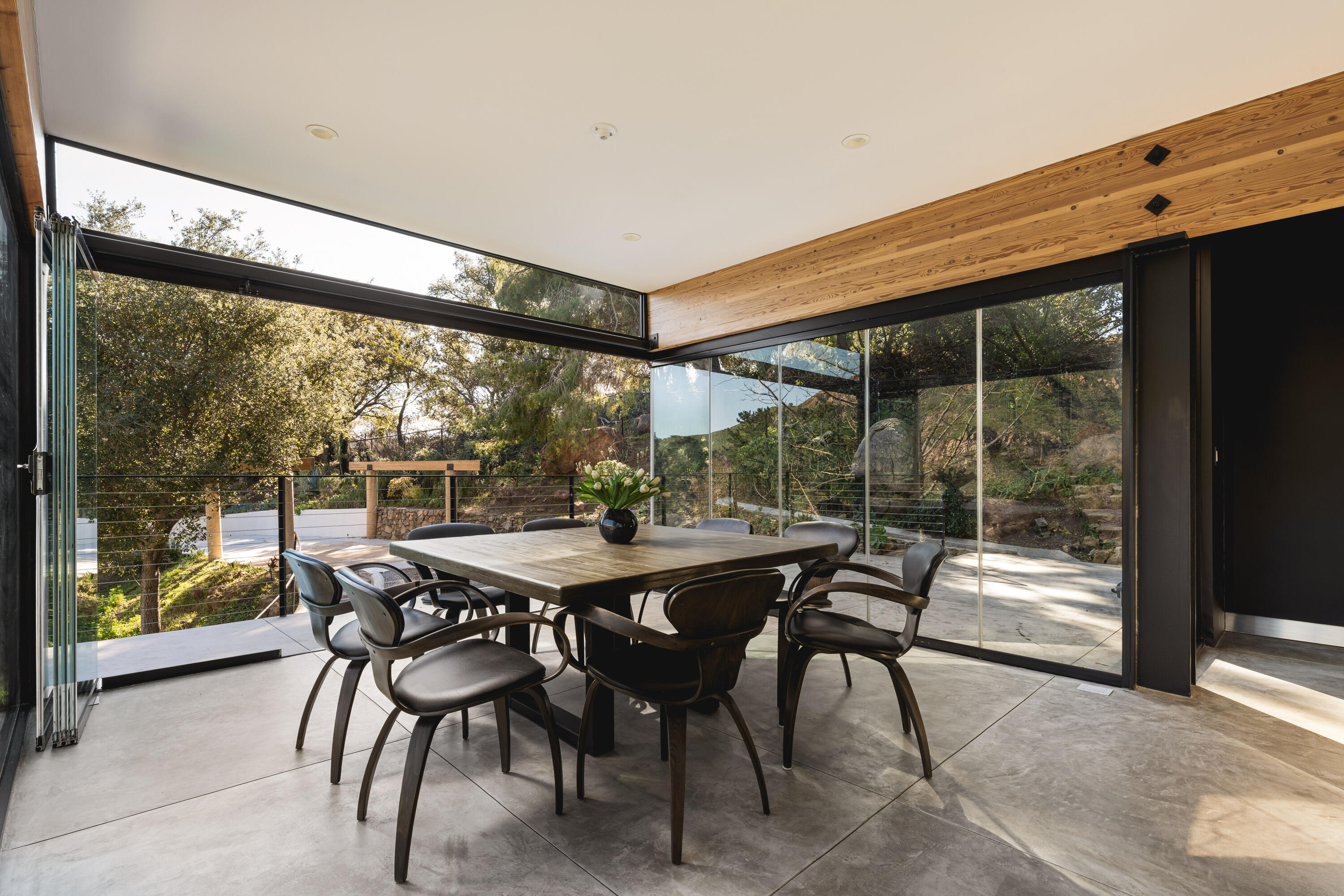 2315 Live Oak Meadows Road Malibu, CA 90265 - Photo 12 of 32 a view of an outdoor dining space with a table and chairs