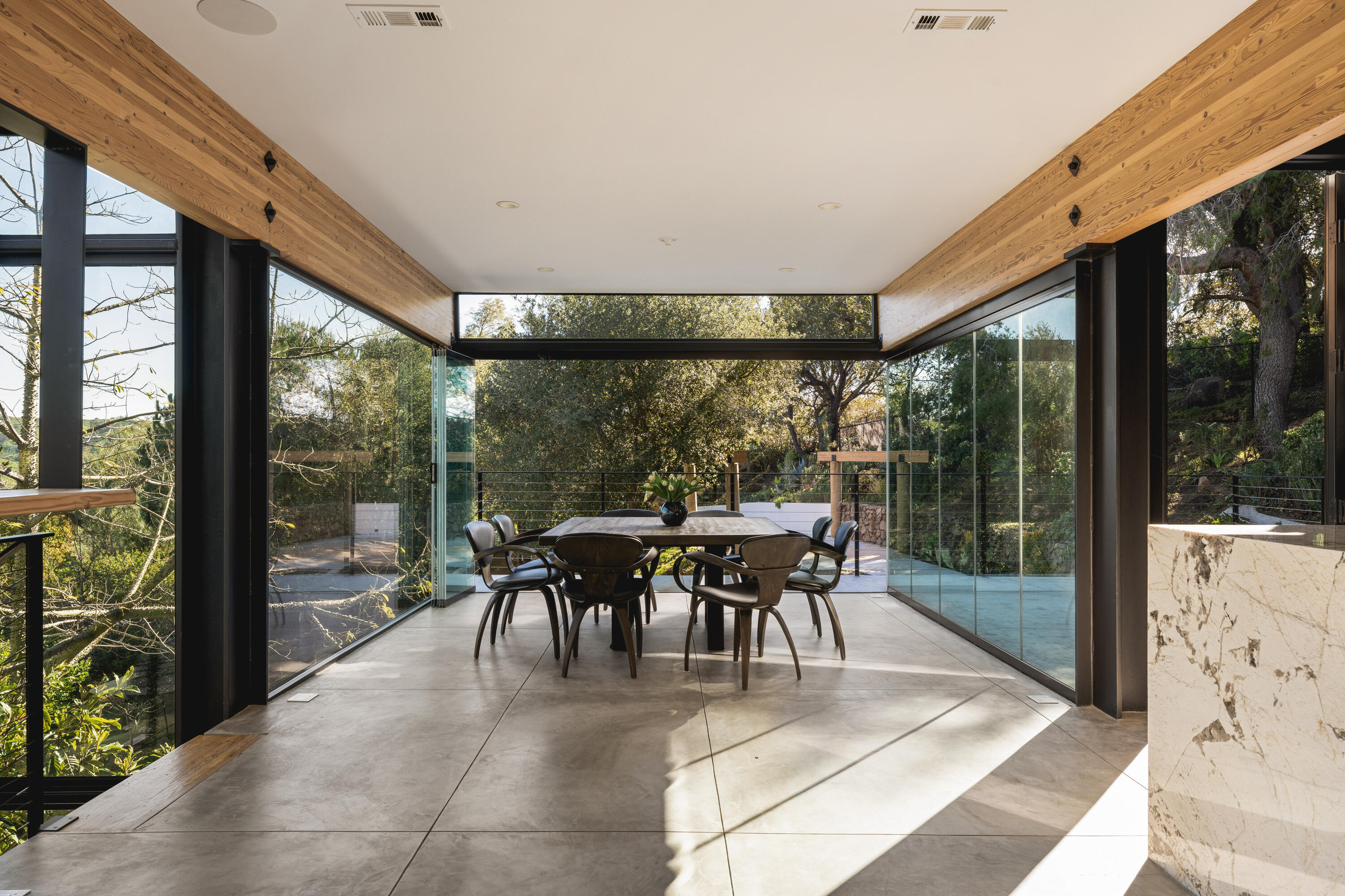 2315 Live Oak Meadows Road Malibu, CA 90265 - Photo 13 of 32 a dining room with furniture and a garden