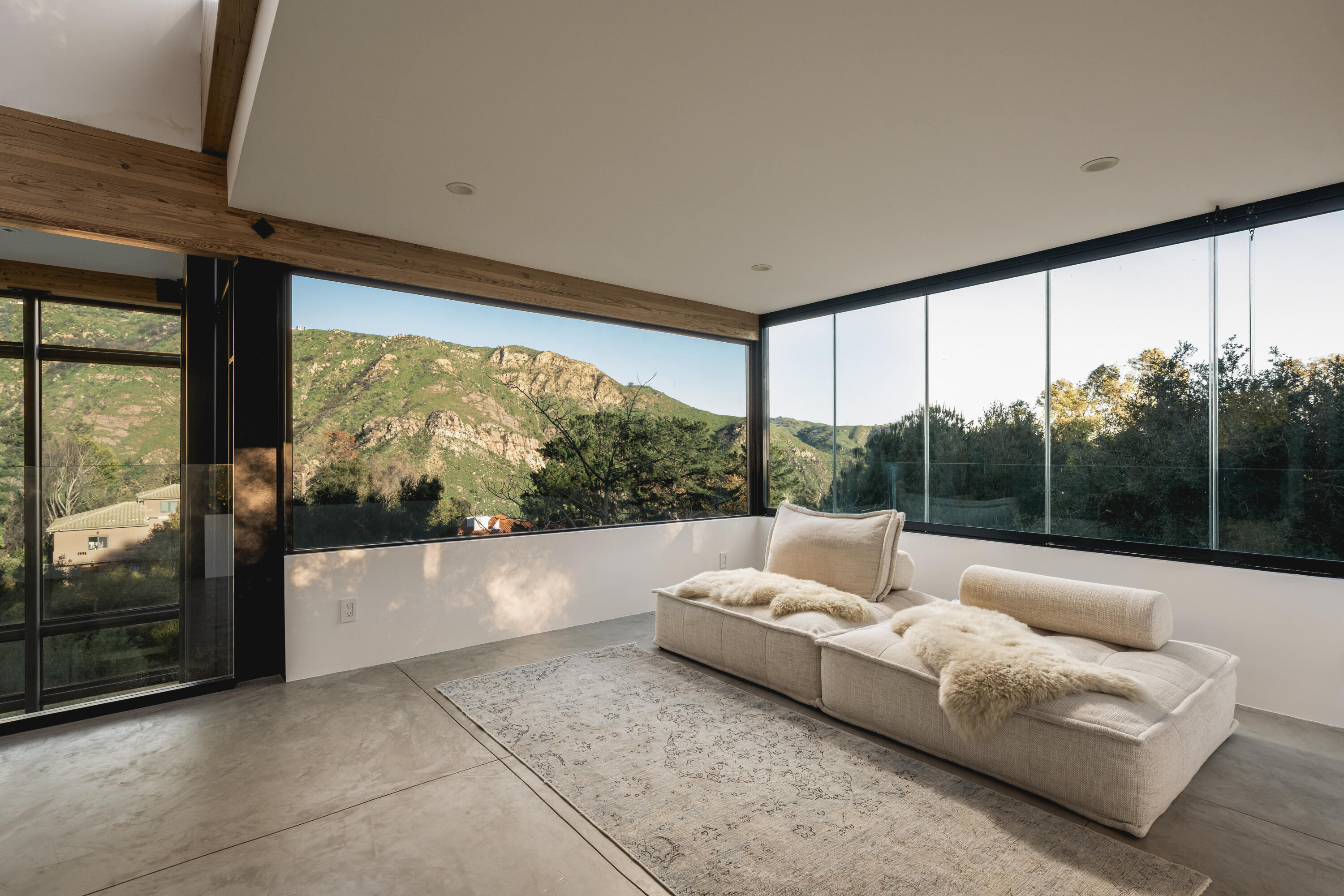 2315 Live Oak Meadows Road Malibu, CA 90265 - Photo 21 of 32 a living room with furniture and a large window