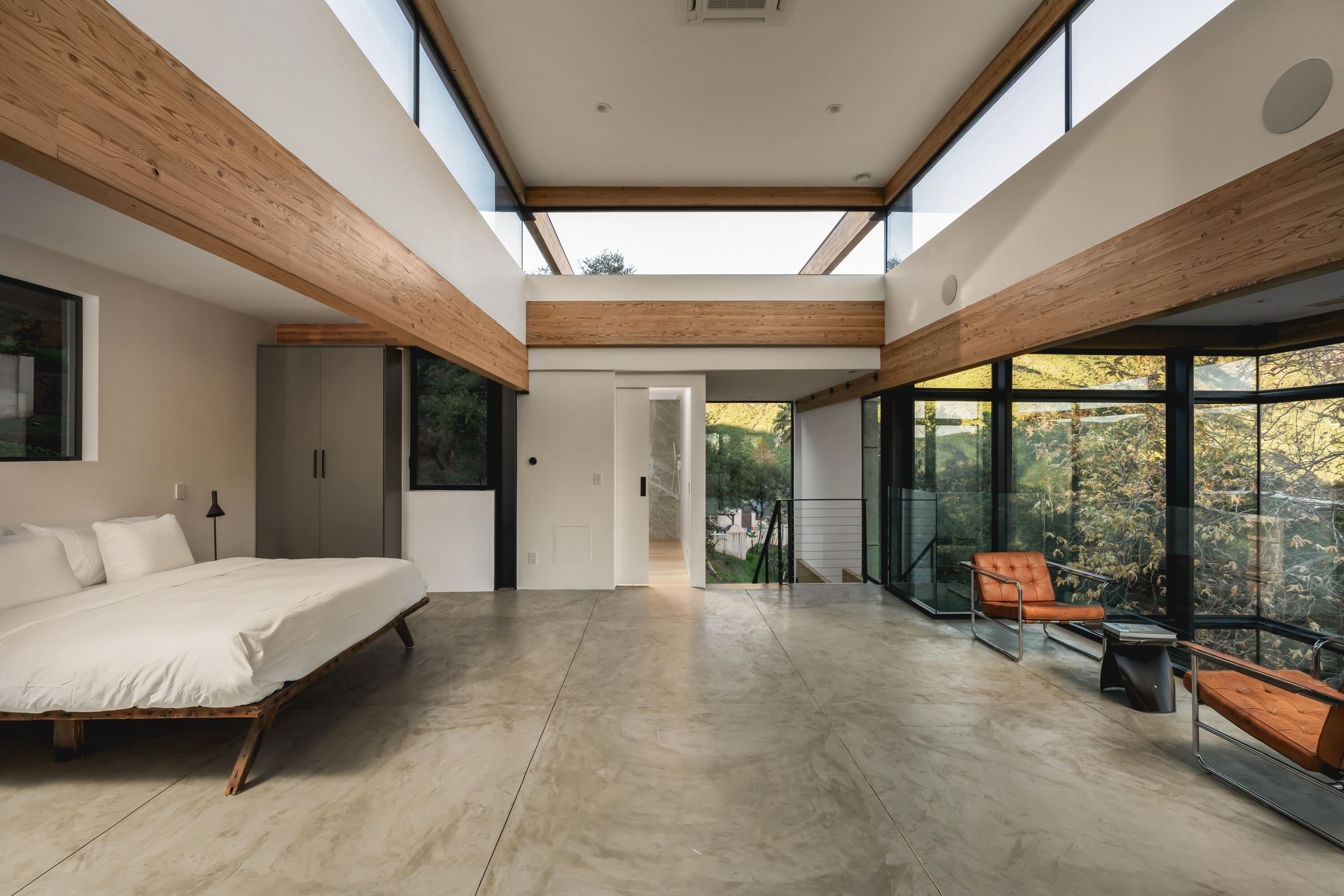 2315 Live Oak Meadows Road Malibu, CA 90265 - Photo 23 of 32 a room with a bed and large windows