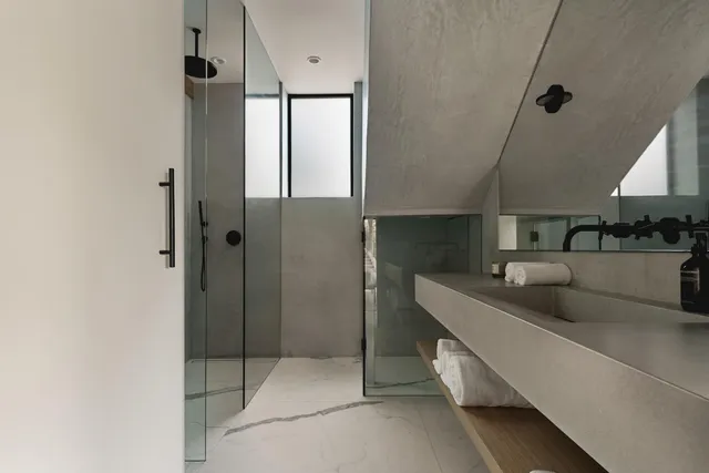 a balcony with table and chairs