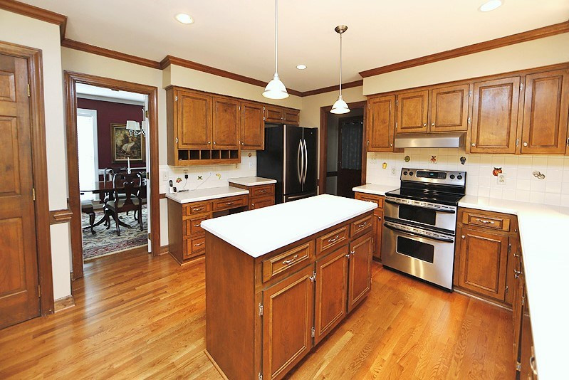 11021 Coachmans Way Raleigh, NC 27614 - Photo 4 of 24 The spacious kitchen has brand new hardwood floors, newer SS appliances, solid surface counters and beautiful cabinets. The French door refrigerator conveys with accepted offer! Kitchen