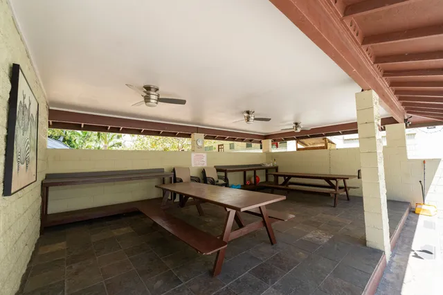 a reading room with furniture and a window