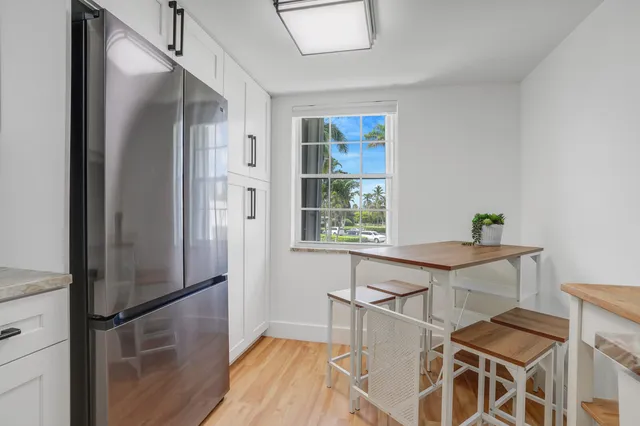 a kitchen with a table and chairs