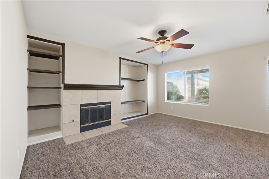250 Settlers Road Upland, CA 91786 - Photo 14 of 31 a view of empty room with a fireplace and fan