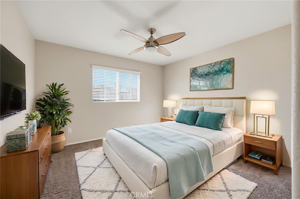 250 Settlers Road Upland, CA 91786 - Photo 17 of 31 a bedroom with a large bed and a potted plant