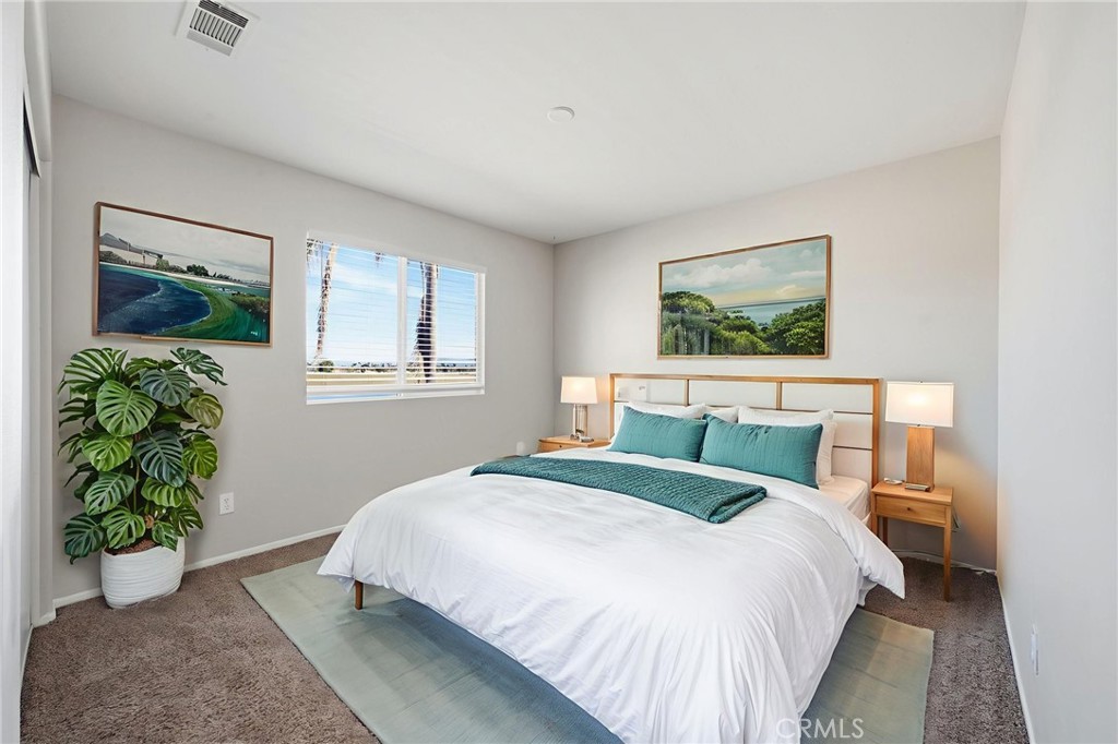 250 Settlers Road Upland, CA 91786 - Photo 20 of 31 a bedroom with a bed and a painting on the wall