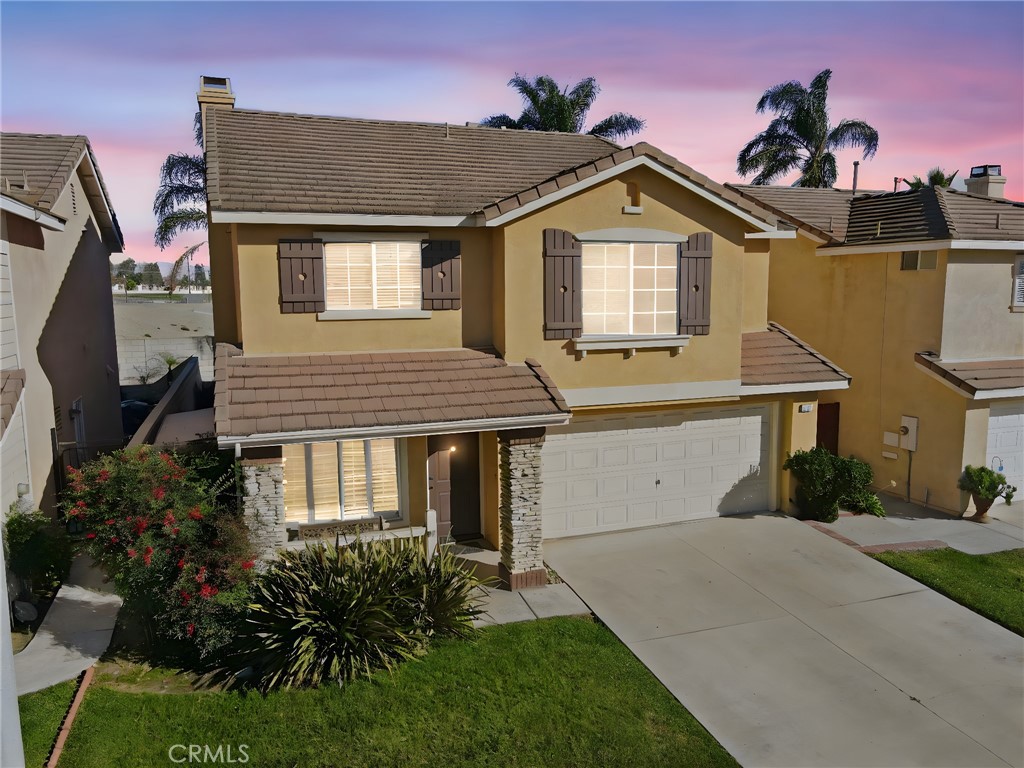 250 Settlers Road Upland, CA 91786 - Photo 2 of 31 a front view of a house with a garden and plants