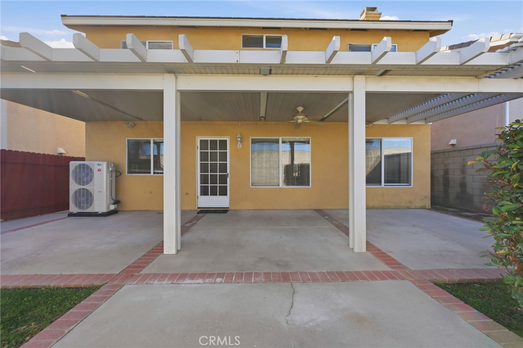 250 Settlers Road Upland, CA 91786 - Photo 28 of 31 a front view of a house with a yard and garage