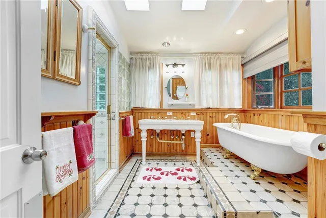 a bathroom with a sink toilet and mirror