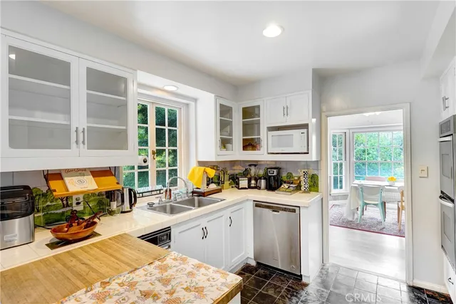 a kitchen with a stove a sink and a refrigerator
