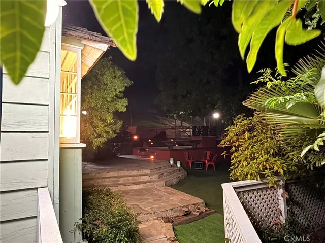 a view of a backyard with sitting area
