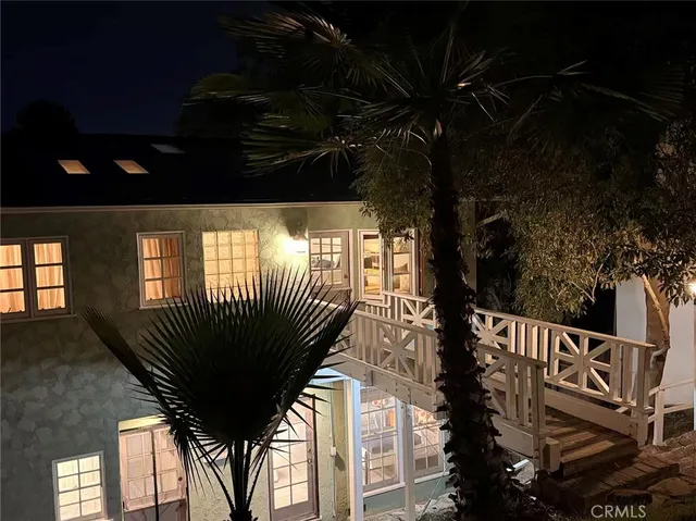 a view of a backyard with sitting area and tub