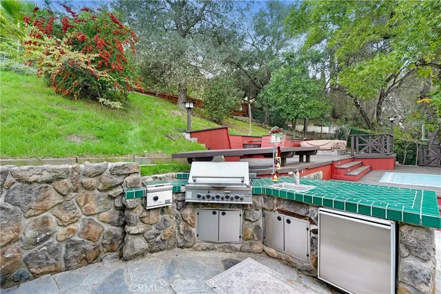 a outdoor sitting area with chairs and wooden floor
