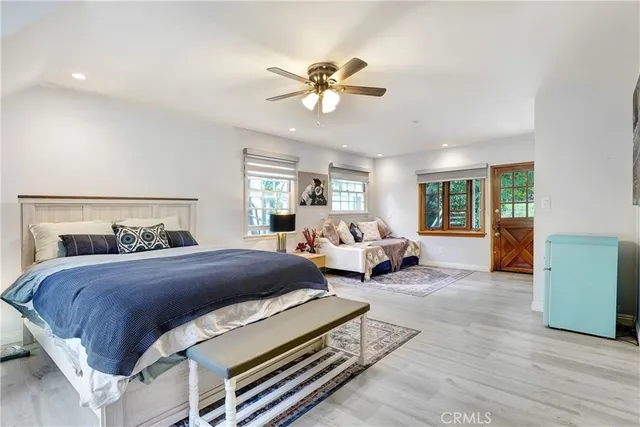 a bedroom with a bed and window