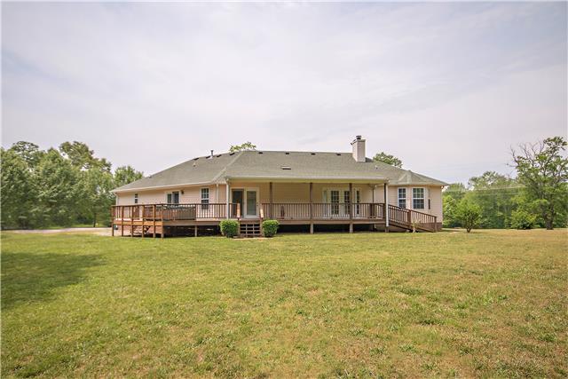2153 Liebengood Road Goodlettsville, TN 37072 - Photo 18 of 20 Rear view of the home showcasing the wraparound deck. There is a ramp on the right side.