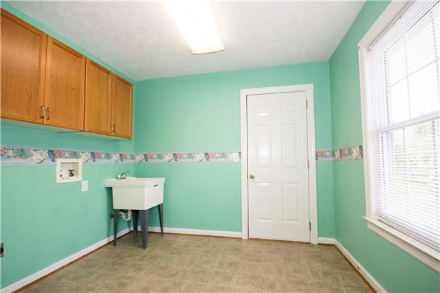 2153 Liebengood Road Goodlettsville, TN 37072 - Photo 7 of 20 Awesome mud/laundry room as you enter from the garage. It offers cabinets & a utility sink!