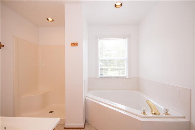 2153 Liebengood Road Goodlettsville, TN 37072 - Photo 9 of 20 The master bath has both a separate shower & a corner garden tub!