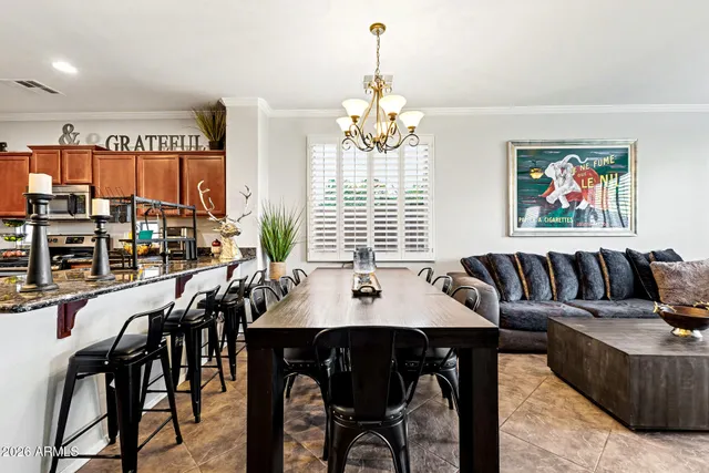a view of a dining room with furniture window and outside view
