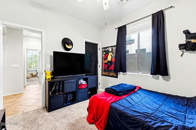 a living room with a flat screen tv and a couch