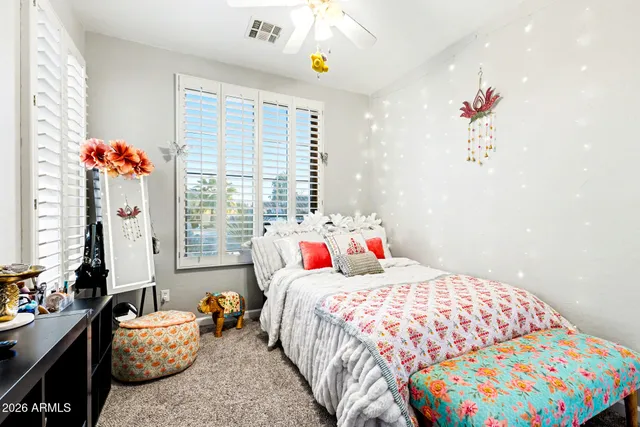 a bedroom with bed and a window