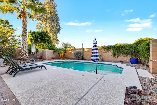 a park view with a bench and trees