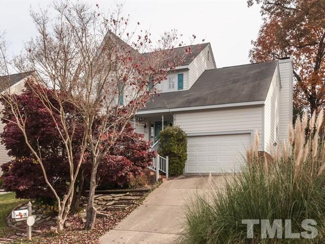 7316 Massachusetts Court Raleigh, NC 27615 - Photo 1 of 16 a front view of a house with a yard and garage