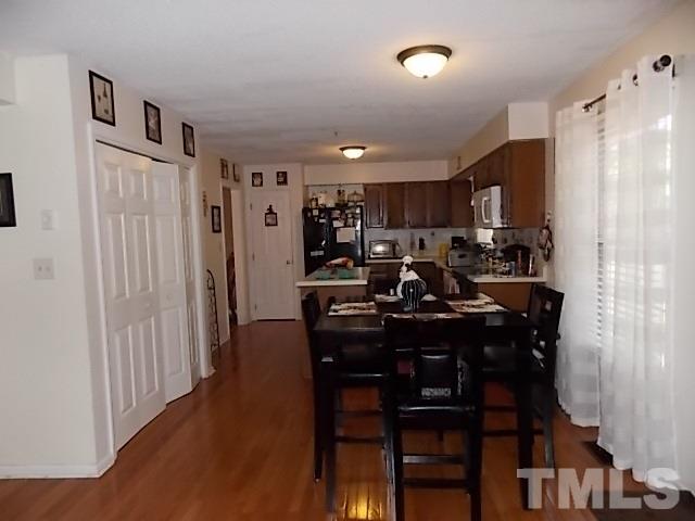 7316 Massachusetts Court Raleigh, NC 27615 - Photo 13 of 16 a view of a dining room with furniture