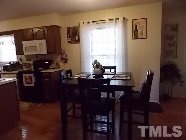 7316 Massachusetts Court Raleigh, NC 27615 - Photo 6 of 16 a view of a dining room with furniture