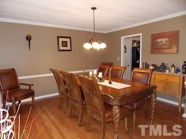 7316 Massachusetts Court Raleigh, NC 27615 - Photo 9 of 16 a dining room with furniture and window
