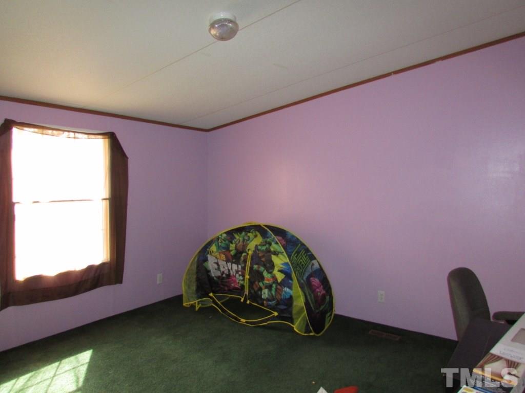 591 Allie Clay Road Roxboro, NC 27573 - Photo 11 of 16 a room with a window
