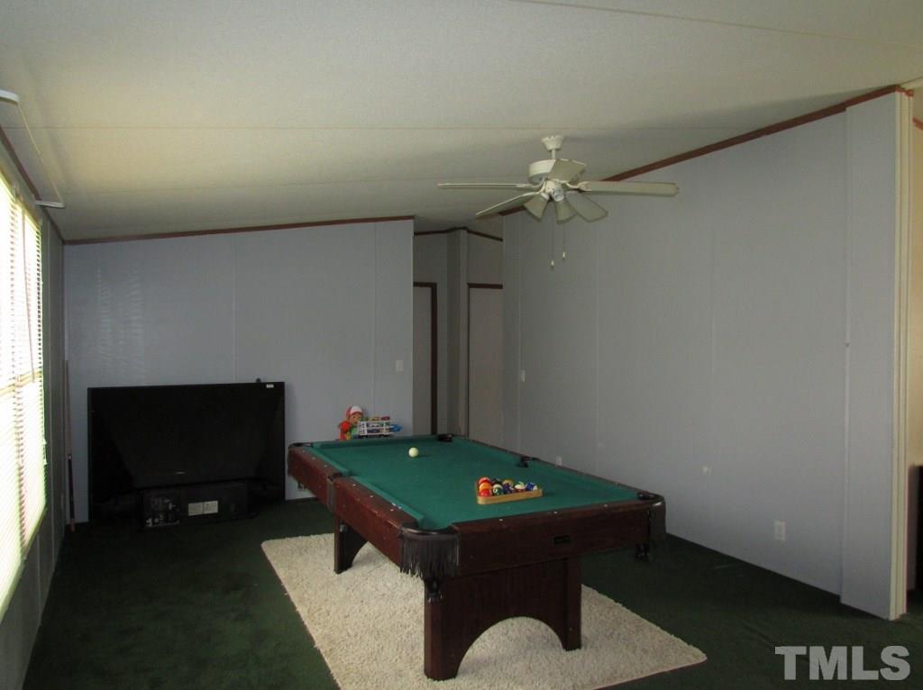 591 Allie Clay Road Roxboro, NC 27573 - Photo 4 of 16 a room with furniture and a fireplace
