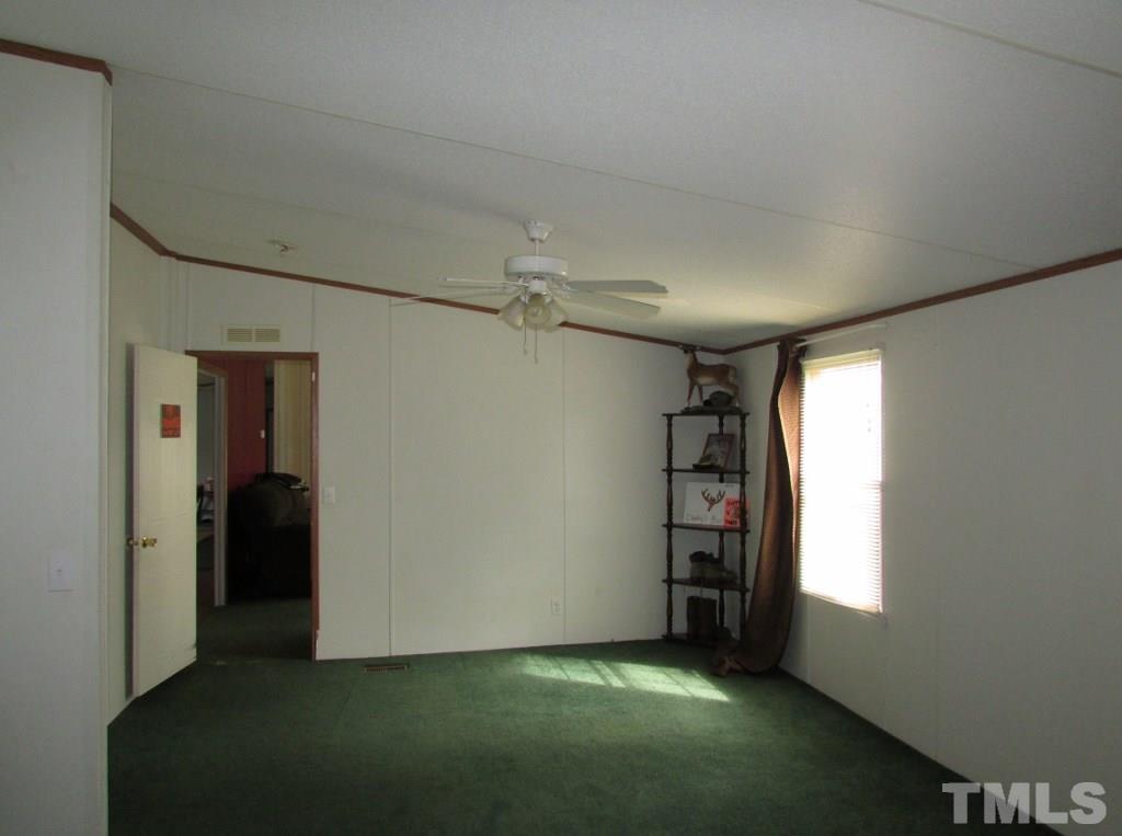 591 Allie Clay Road Roxboro, NC 27573 - Photo 7 of 16 a view of an empty room with a window