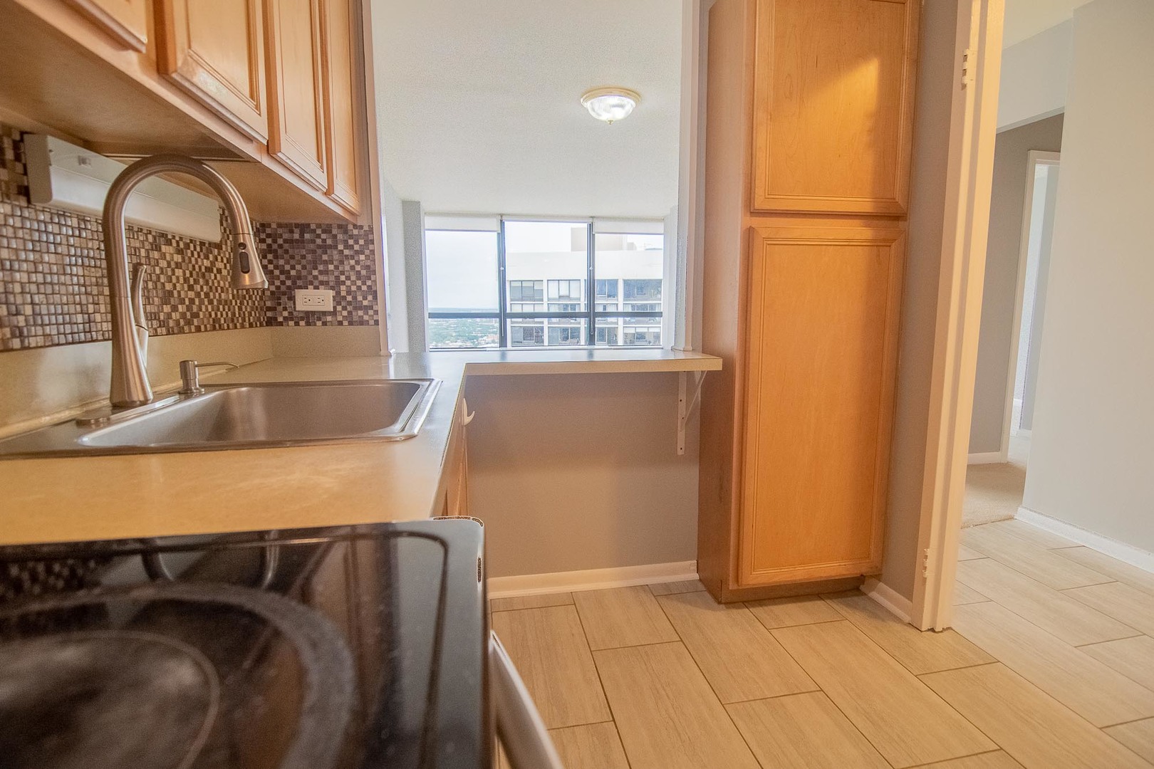 5415 North Sheridan Road, Unit 3808 Chicago, IL 60640 - Photo 7 of 16 a view of walk in closet with window and sitting area