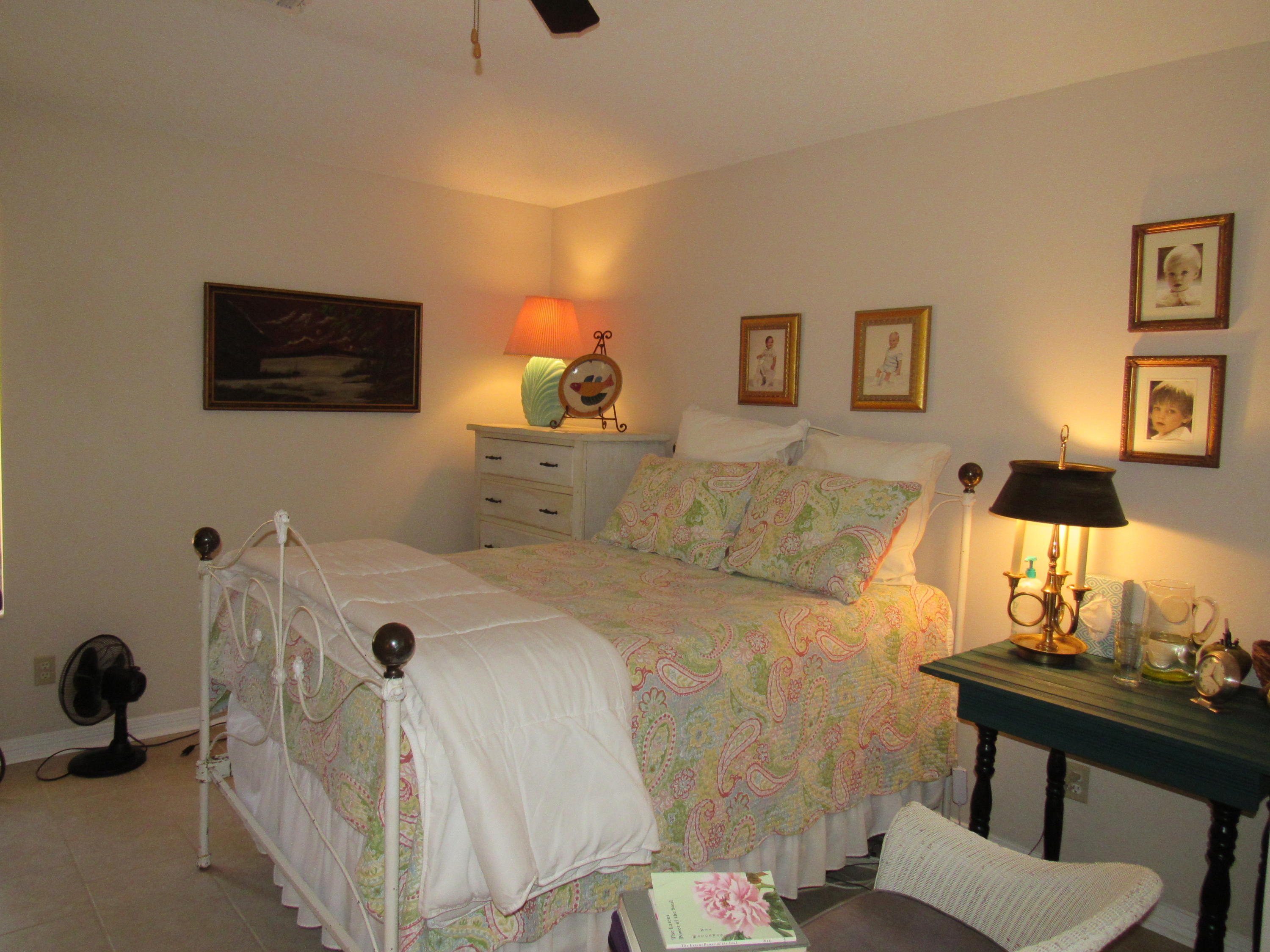 4736 Bob Sikes Road DeFuniak Springs, FL 32435 - Photo 11 of 16 a bed room with a bed and a couch